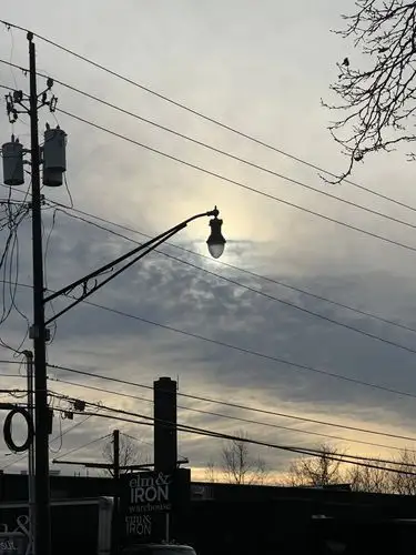 Urban glow, finding light amidst the dramatic clouds.